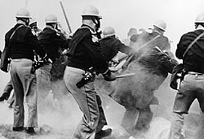 Alabama state troopers attack John Lewis and other voting-rights marchers crossing the Edmund Pettus Bridge in Selma on 7 March 1965 ("Bloody Sunday"). National outrage at the televised violence pushed the Voting Rights Act through Congress within five months.