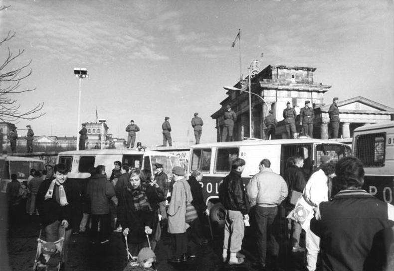 West Berlin police vehicles holding back a large crowd at the Brandenburg Gate on 11 November 1989, two days after the border opening