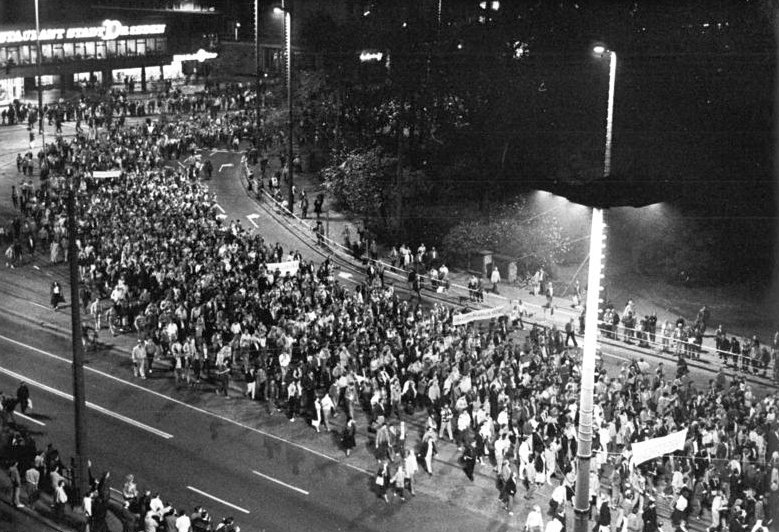 Aerial view of a vast crowd filling a Leipzig street and square at the Monday demonstration of 23 October 1989, two and a half weeks before the Berlin Wall opened.